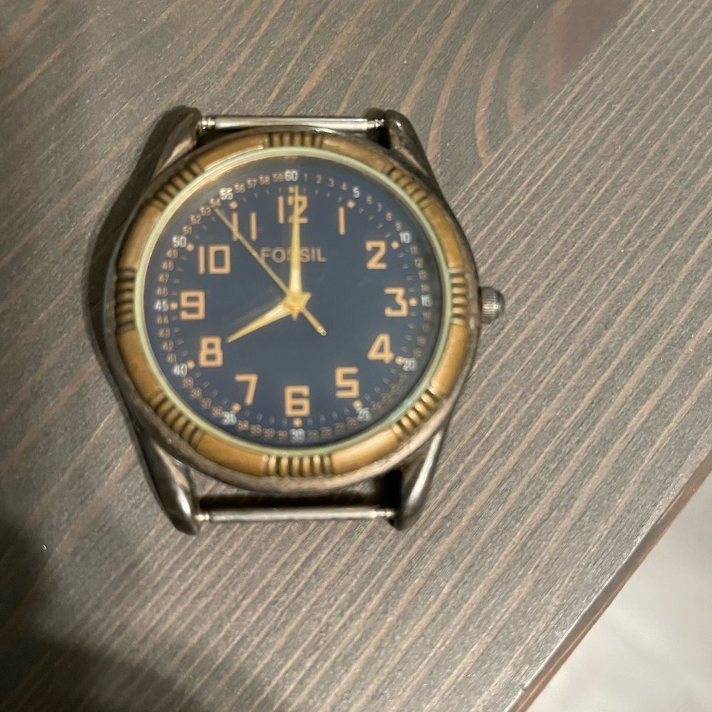 vintage Fossil unisex watch with model number EC-6835 dark blue face gold trim